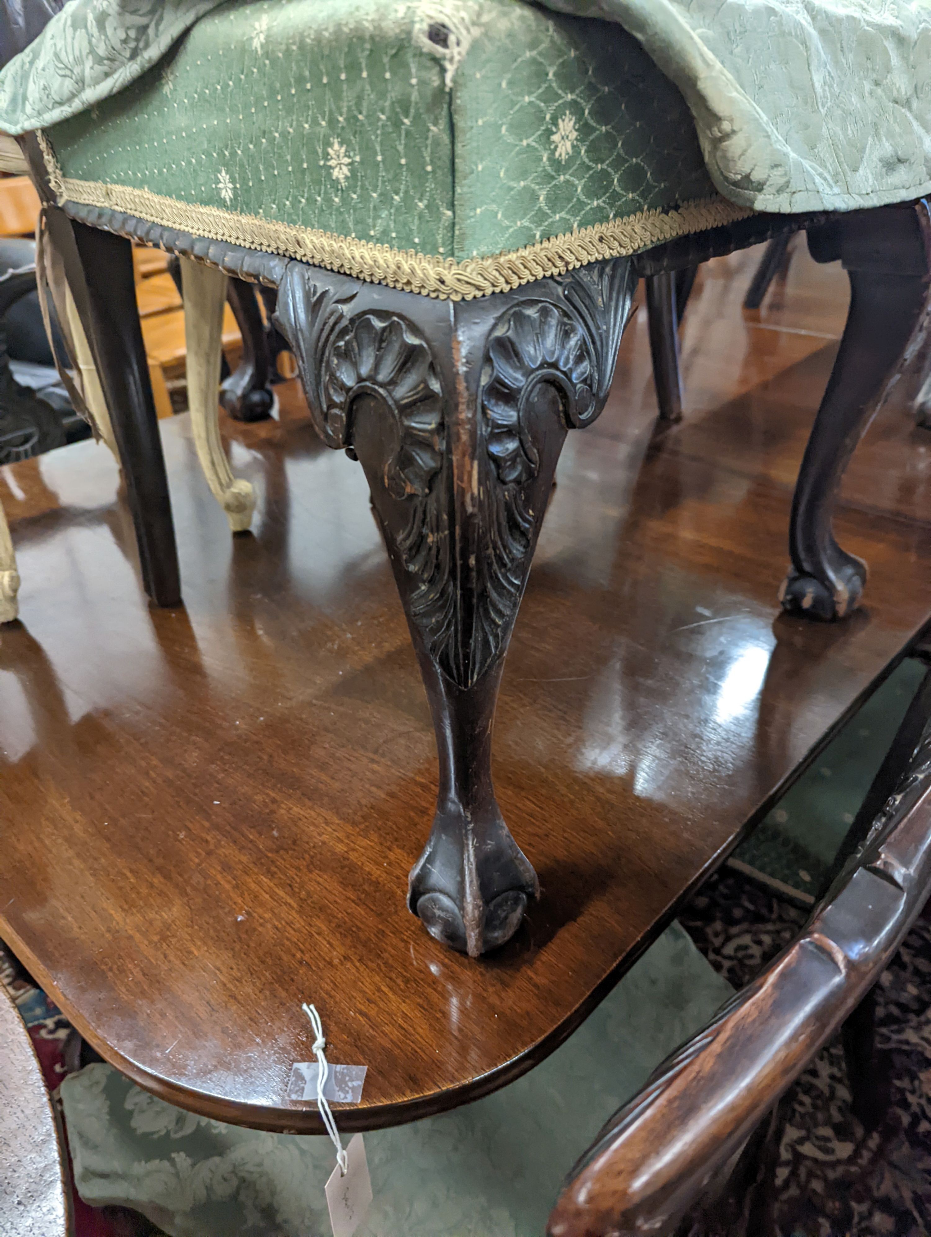 A set of twelve early 20th century Chippendale revival carved mahogany dining chairs including two carvers, width 56cm, height 95cm